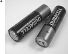 FIGURE 4.2. Cylindrical Battery: Where Constraints Are Needed. Figure A shows the traditional cylindrical battery that requires correct orientation in the slot to work properly (and to avoid damaging the equipment). But look at Figure B, which shows where two batteries are to be installed. The instructions from the manual are shown as an overlay to the photograph. They seem simple, but can you see into the dark recess to figure out which end of each battery goes where? Nope. The lettering is black against black: slightly raised shapes in the dark plastic.